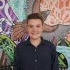 A photo of a smiling boy.