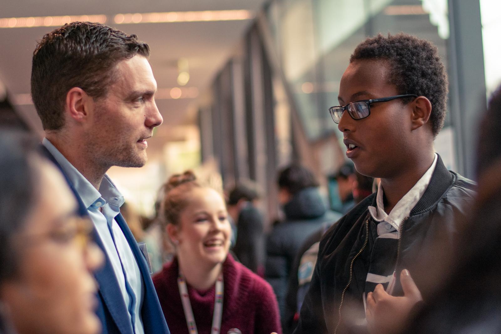 Adult listening intently to student