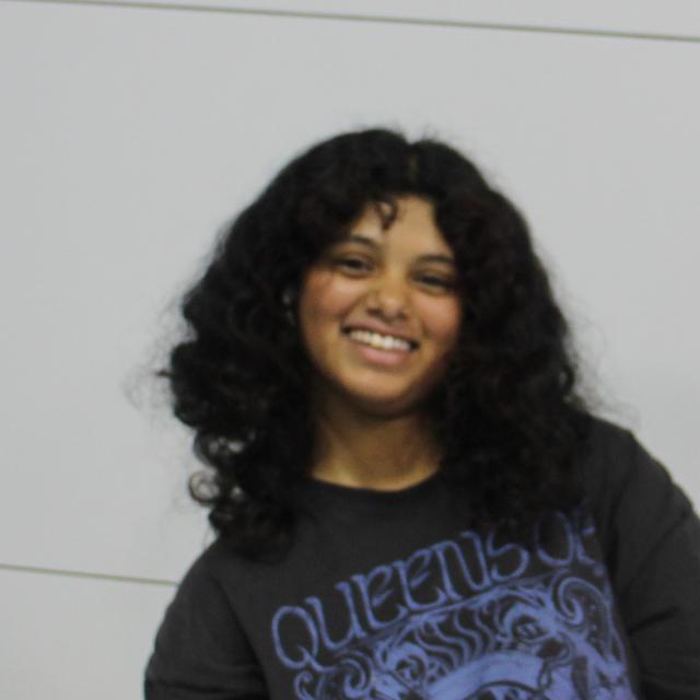 A photo of a girl smiling.