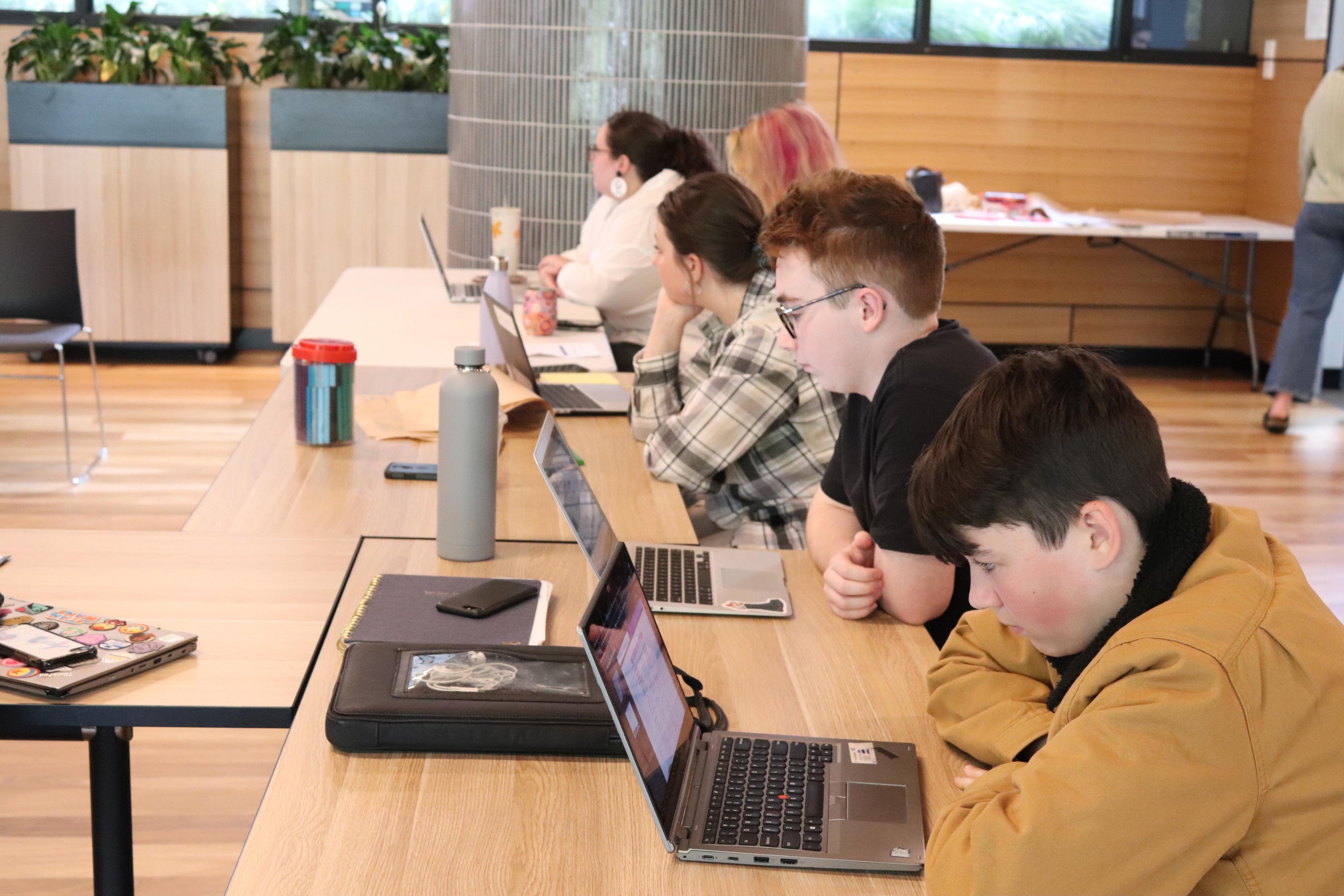 students with laptops