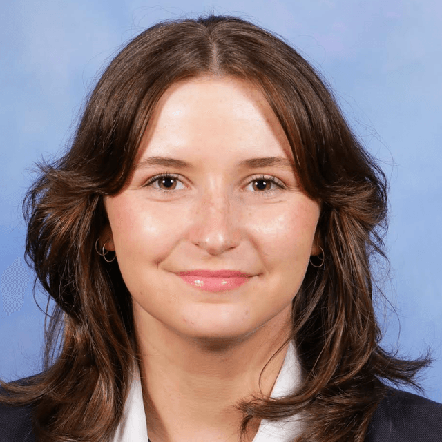 A photo of a girl smiling.