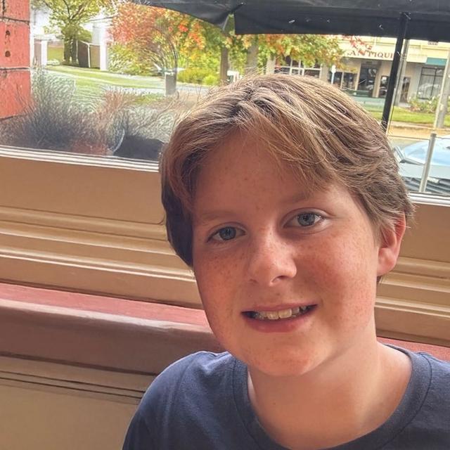 A photo of a smiling boy.