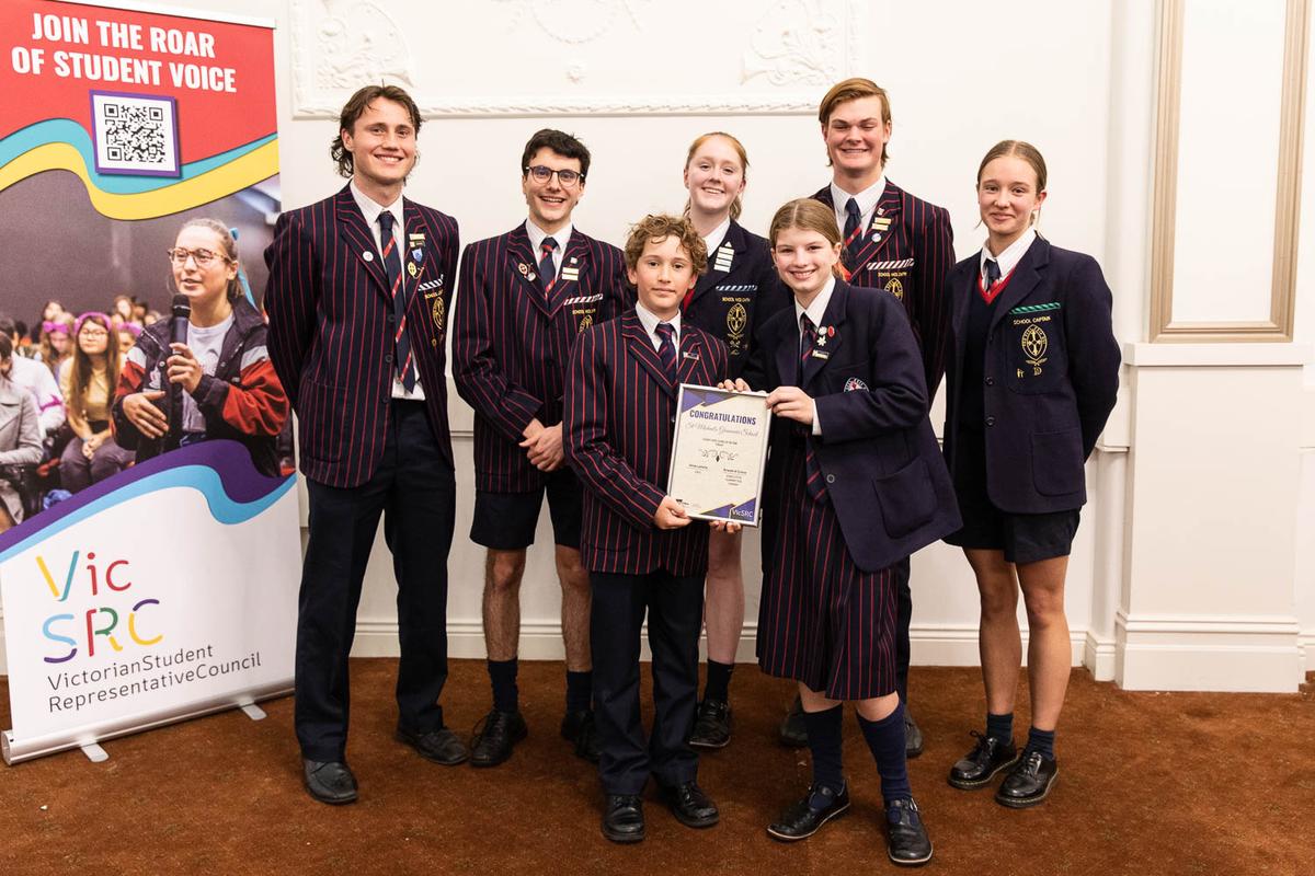 A group of students from St Michael's stand together holding their finalist certificate.